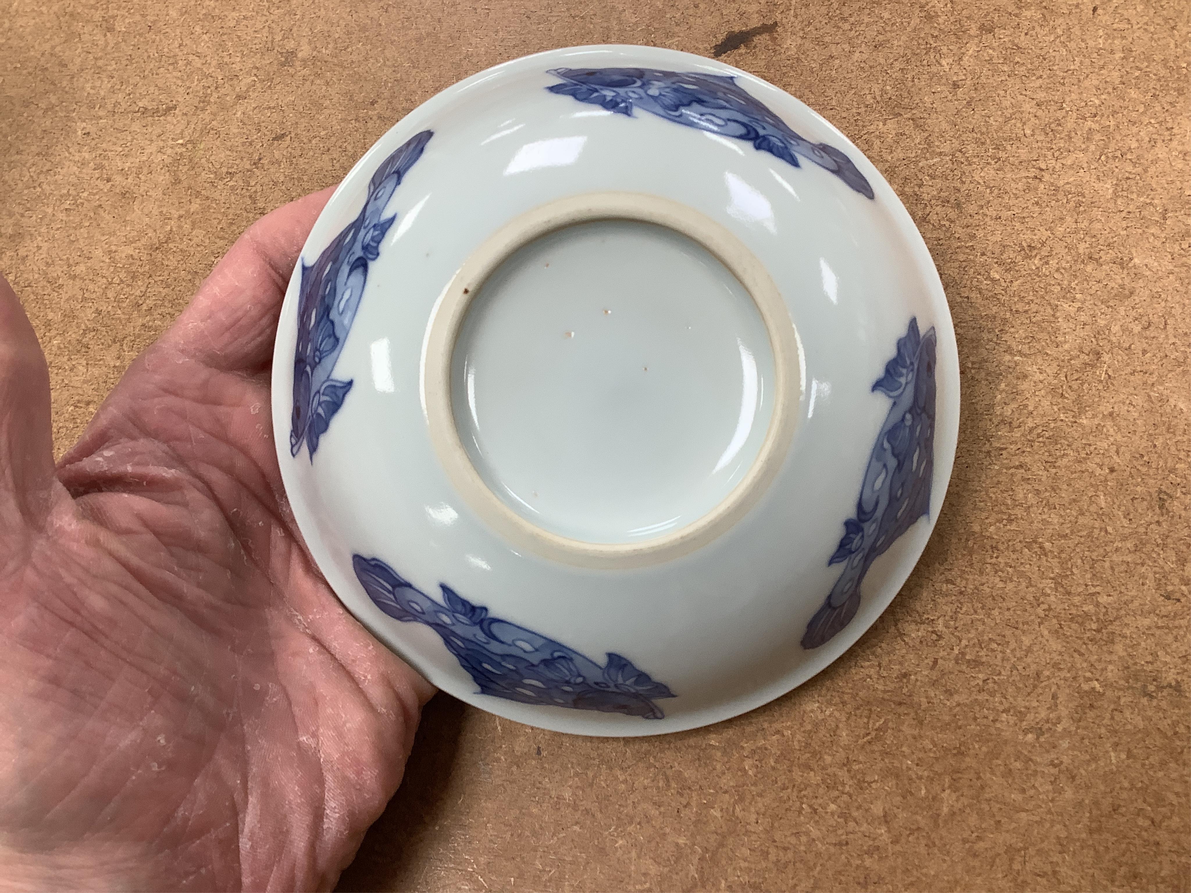 A Chinese blue and white vase and a ‘fish’ saucer dish, largest 19cm high